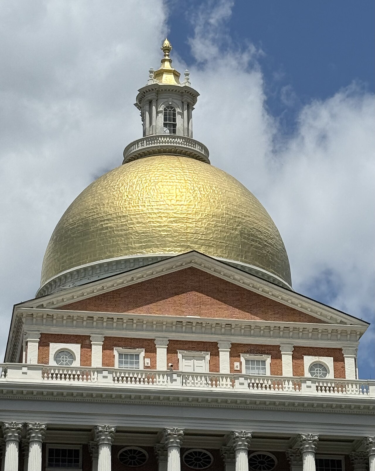 The gilded golden dome of the Massachusetts State House atop Beacon Hill.